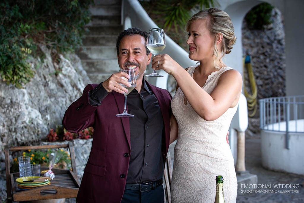 bride and groom having a toast at their elopement on the Amalfi Coast
