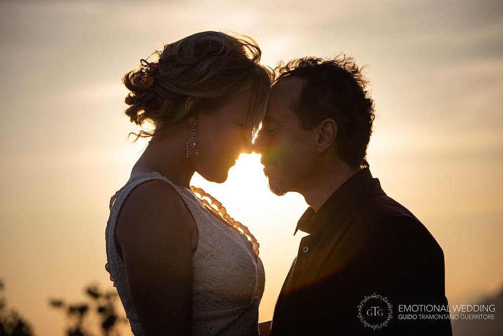 silhouette at sunset of a bride and groom elopement on Amalfi Coast