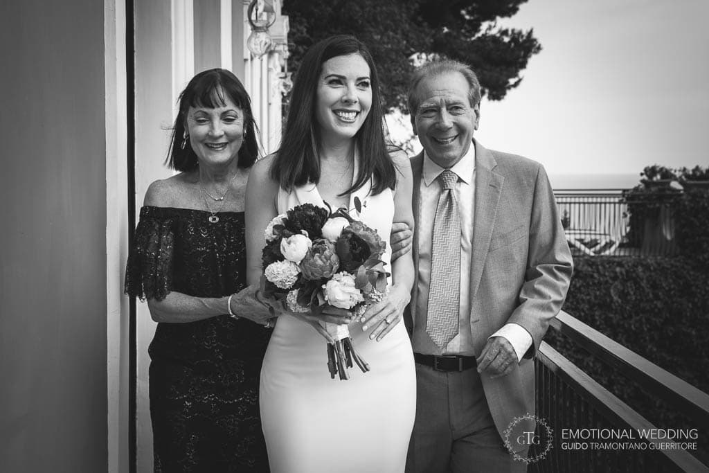 bride and her parents going to the wedding ceremony in Positano