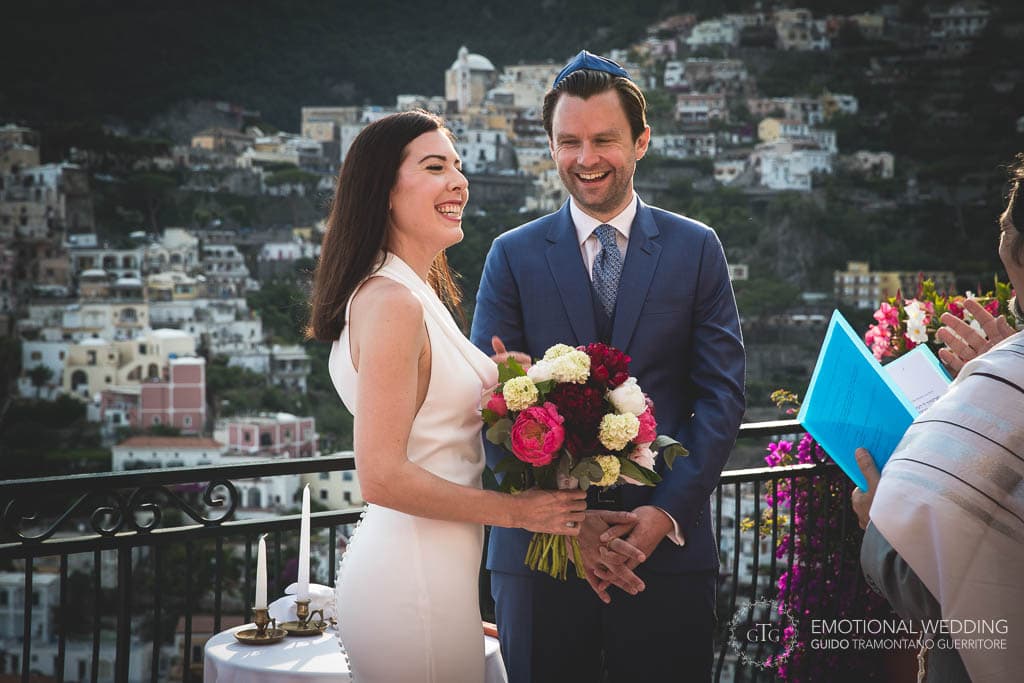 bride and groom smiling during wedding ceremony in Positano