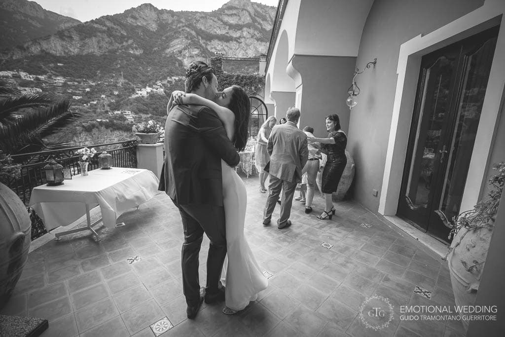 wedding couple kissing during wedding dance in Positano