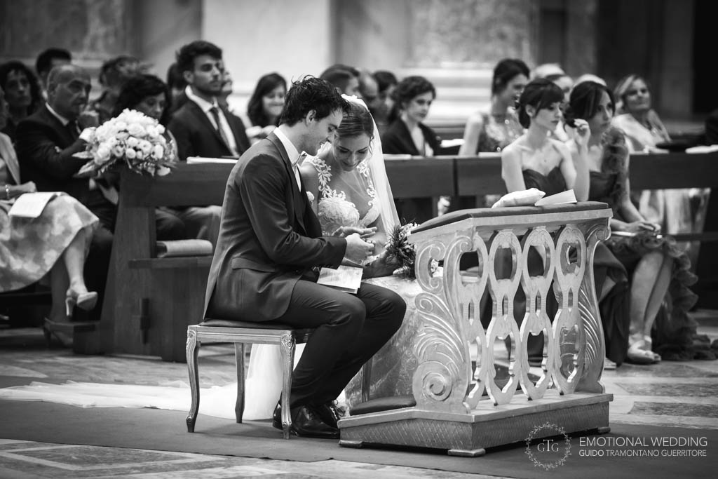 bride and groom looking at their vows during wedding ceremony in Napoli