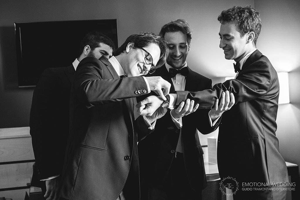 candid shot of a groom and best men taken by a wedding photographer in apulia