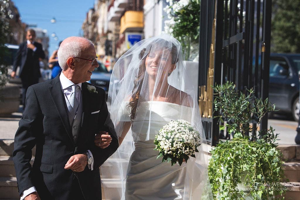 bride and her father entering the church at a wedding in apulia