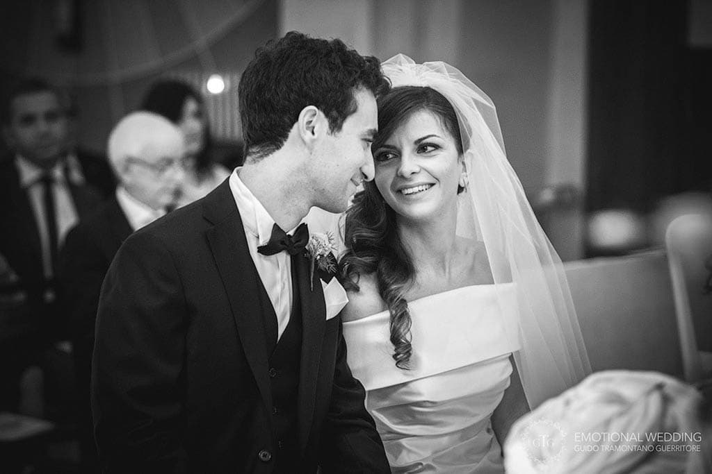 candid of bride and groom at their ceremony taken by a wedding photographer in apulia