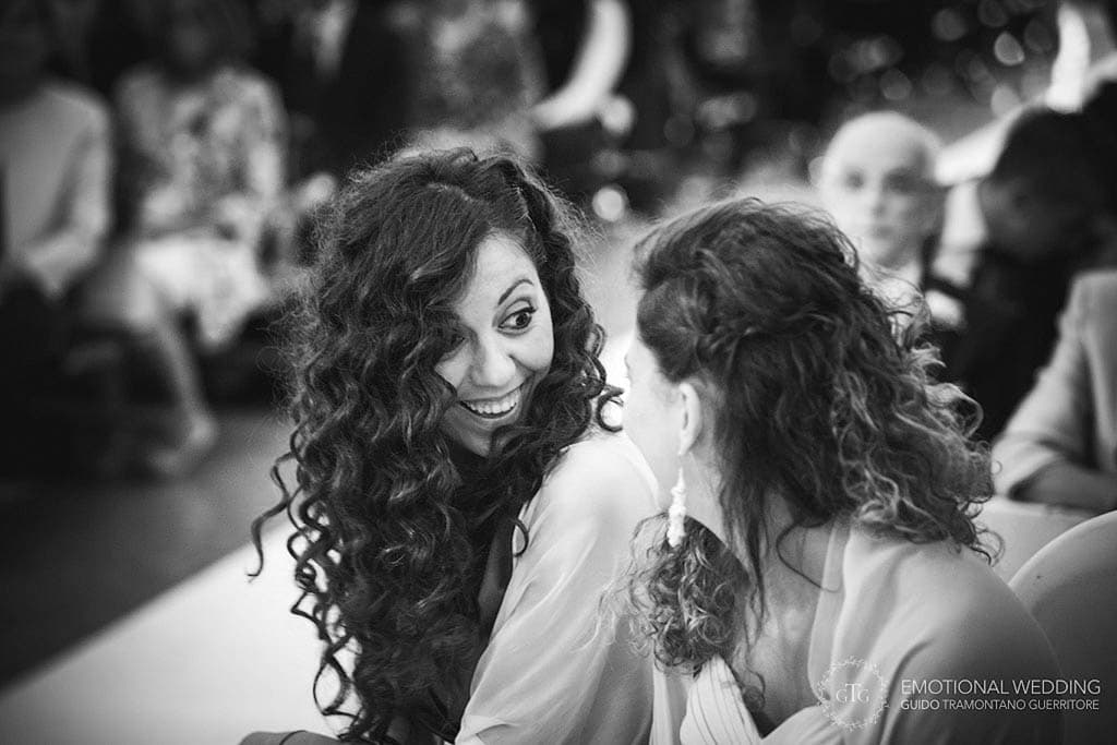 funny expression of a bridesmaid at a wedding ceremony in apulia