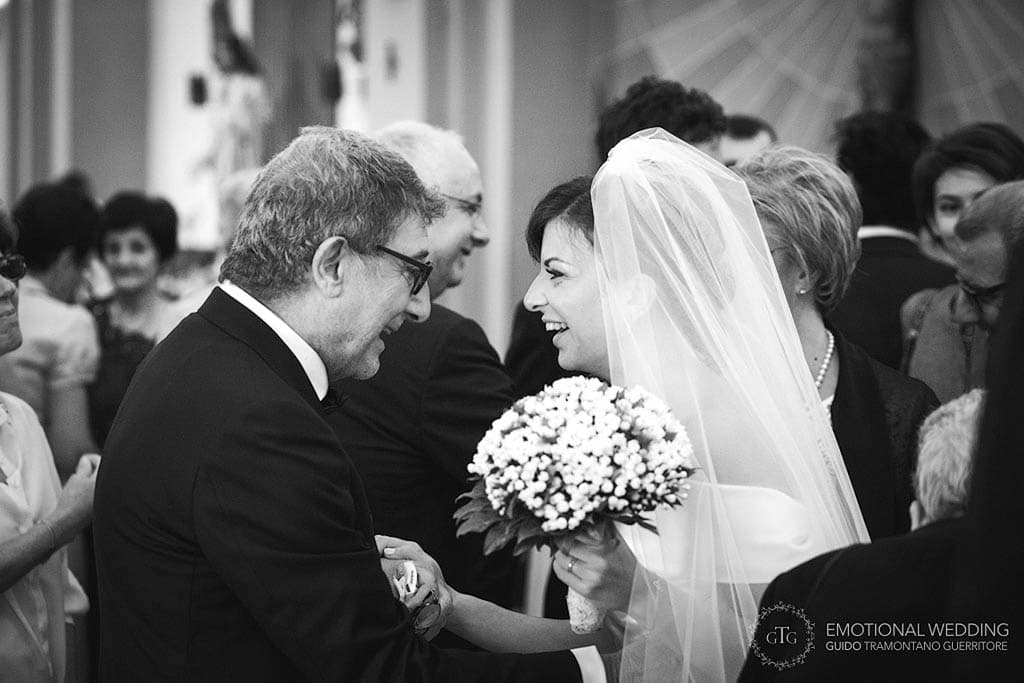 bride smiling at her father in law at a wedding in puglia