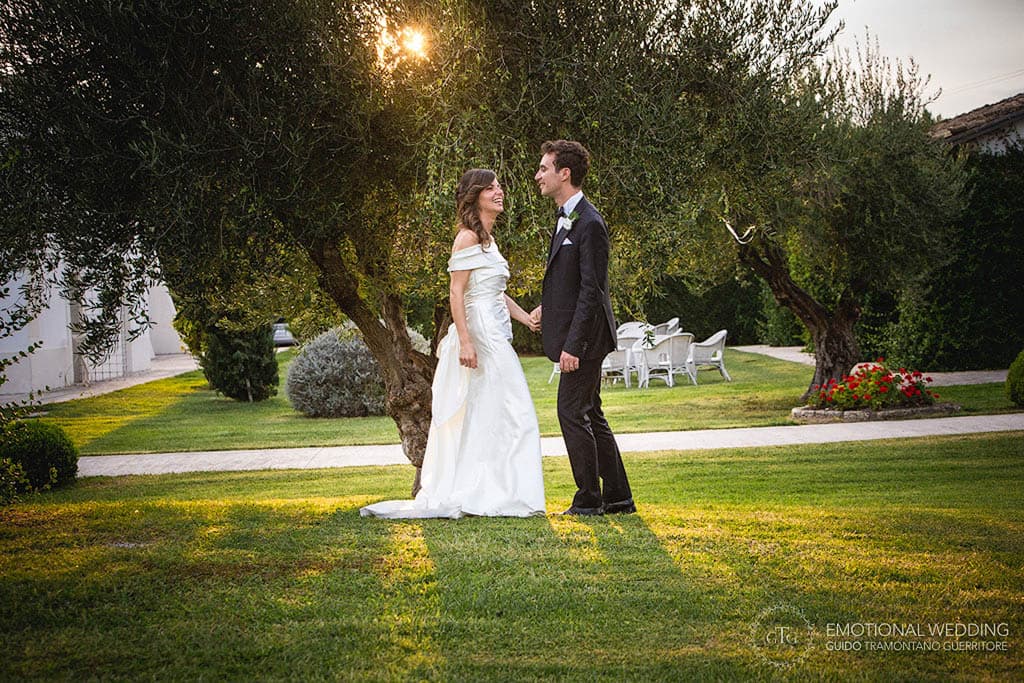 portraiture of bride and groom at sunset in the garden taken by a wedding photographer in apulia