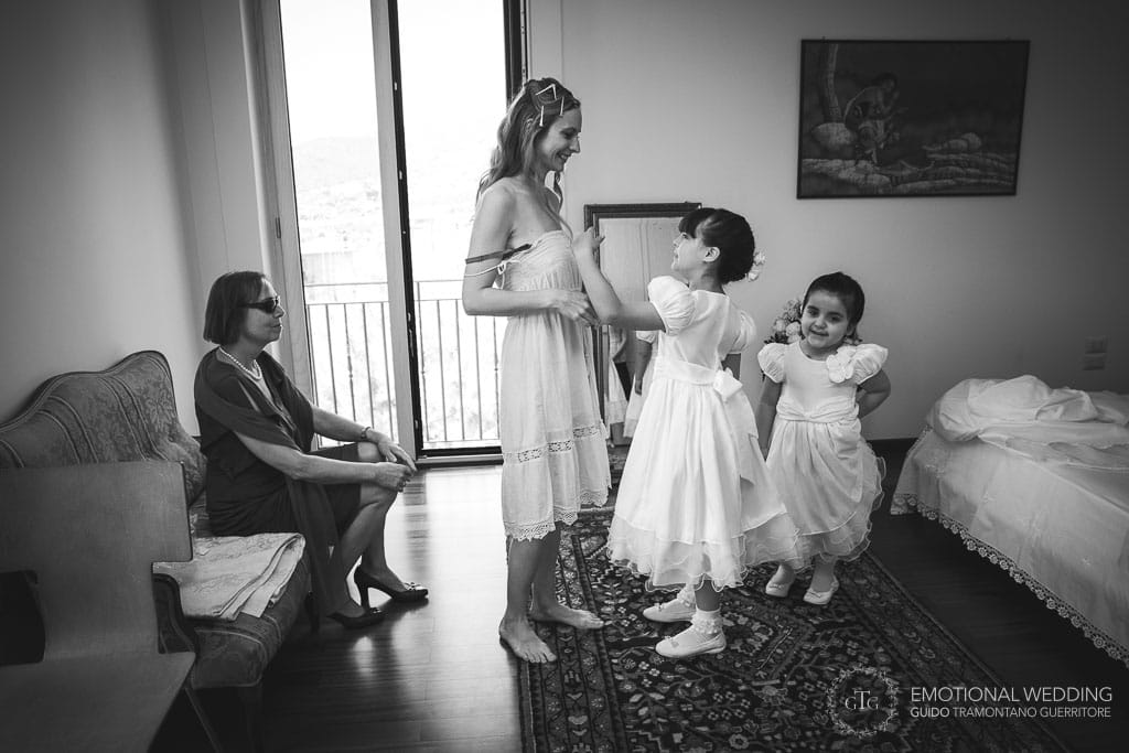 bride and flower girls playing while getting ready for the wedding ceremony in cilento