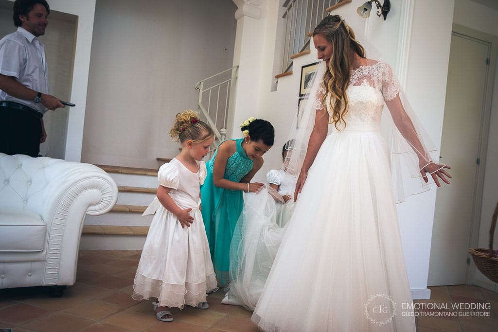 flower girls help the bride getting ready for the wedding ceremony in cilento