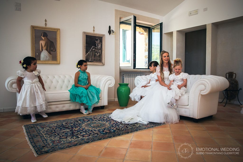 bride and flower girls relaxing before the ceremony