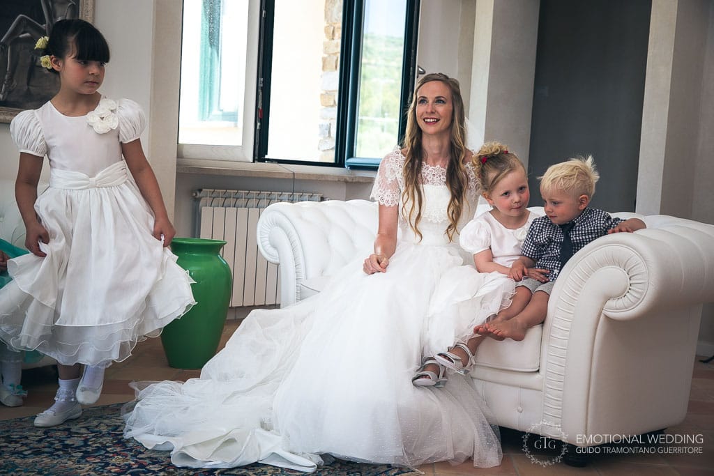 bride and children relaxing after getting ready at a wedding in cilento
