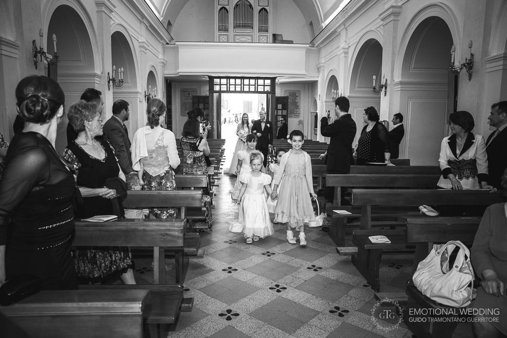 bride walking down the aisle in the church of Santa Maria in cilento