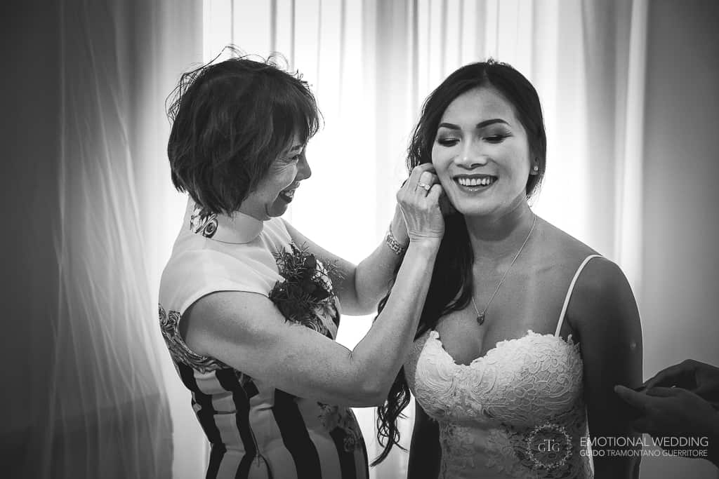 mother of the bride and the bride getting ready for a mixed wedding in Amalfi coast