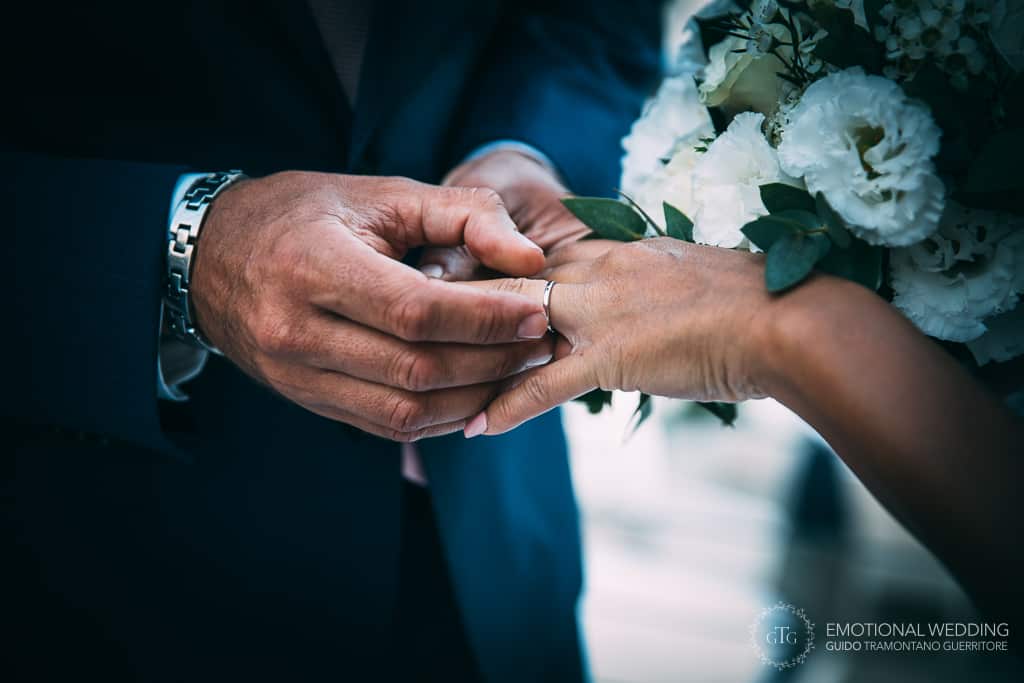 exchange of the ring of a mixed wedding couple in Amalfi coast