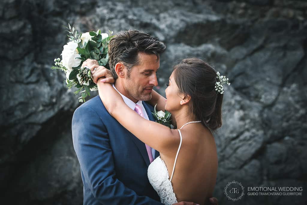 romantic moment of a mixed wedding couple in Amalfi coast