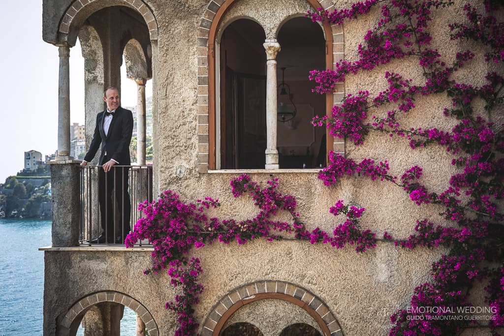 irish groom on the balcony at villa Scarpariello in Amalfi coast