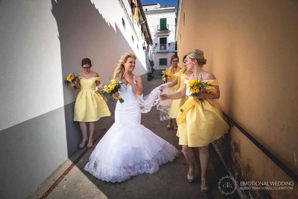 bride and bridesmaids walking to the church at an irish wedding in Praiano, Amalfi coast