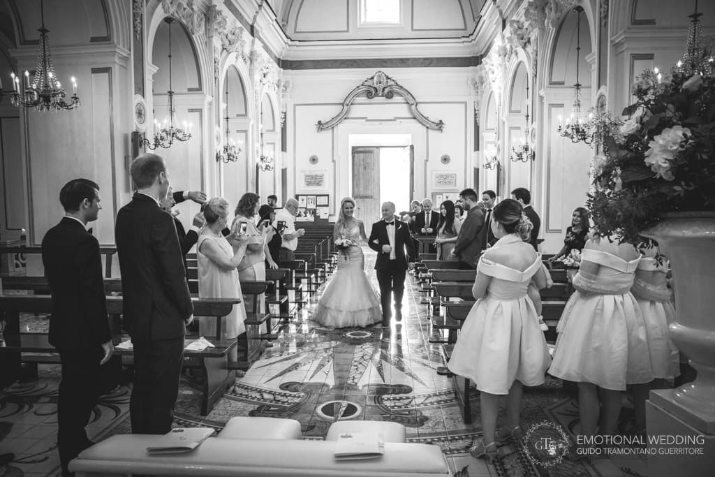 bride walking down the aisle at san Gennaro church in Praiano, amalfi coast