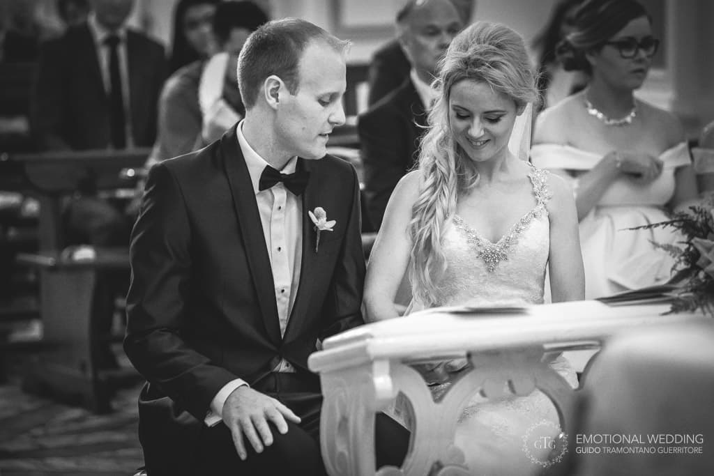 bride and groom looking at their vows after ring exchange at a wedding in amalfi coast