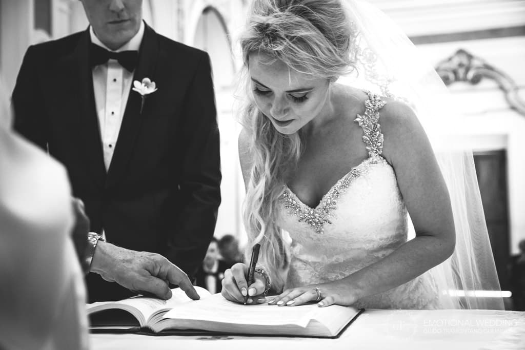 bride signing marriage certificate at church of san Gennaro in Praiano, Amalfi coast