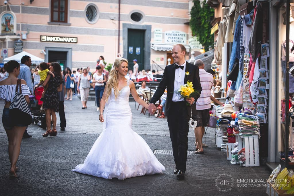 bride and groom walking in Amalfi