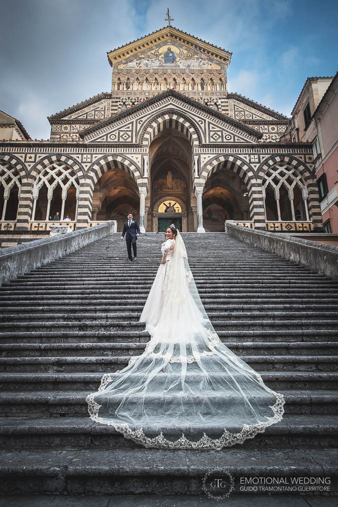 portrait of wedding couple on the amalfi cathedral steps
