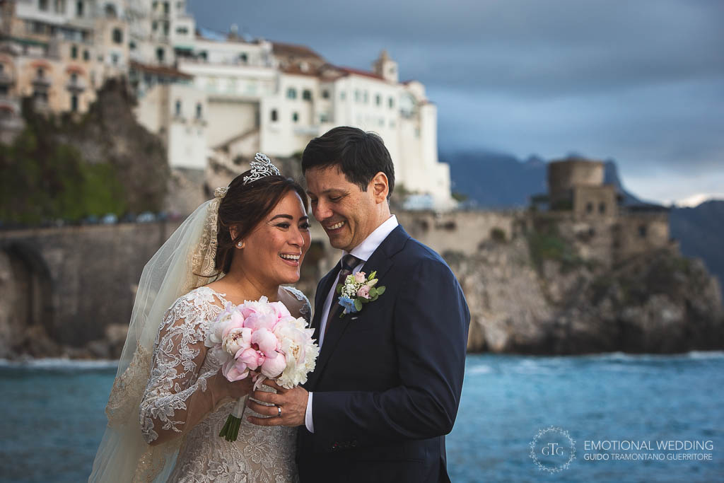 wedding couple and attain in the background in Amalfi Coast