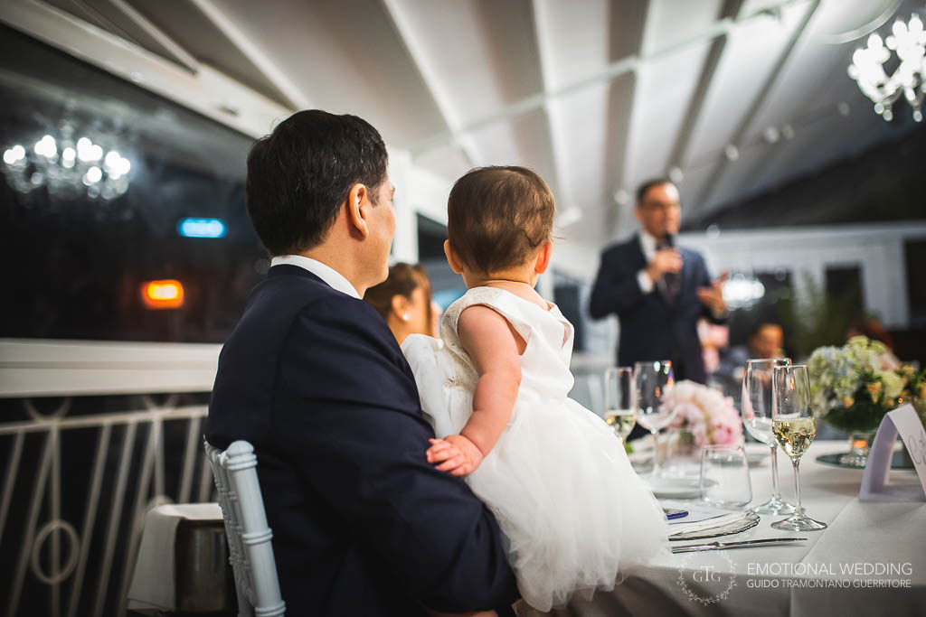 groom and her daughter listening a wedding speech at africana in praiano