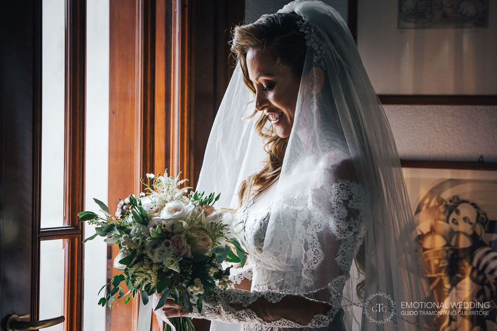 a bride looking at her bouquet