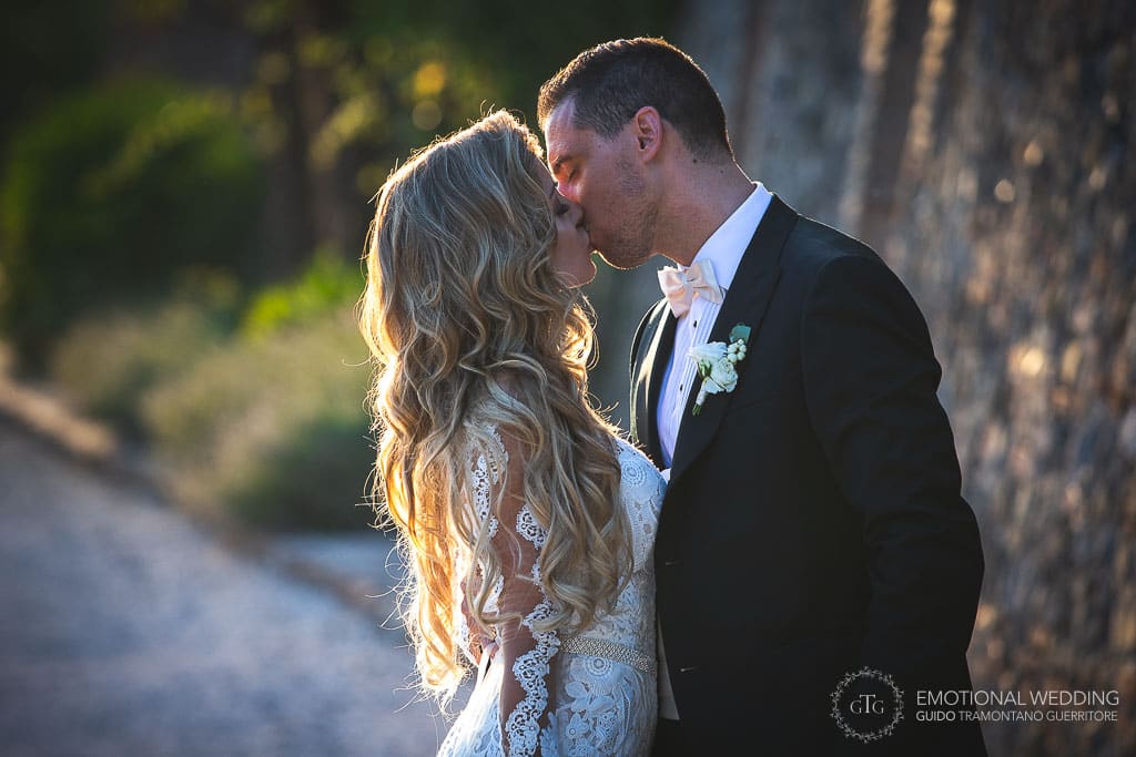 candid of a wedding couple kissing taken by a destination wedding photographer
