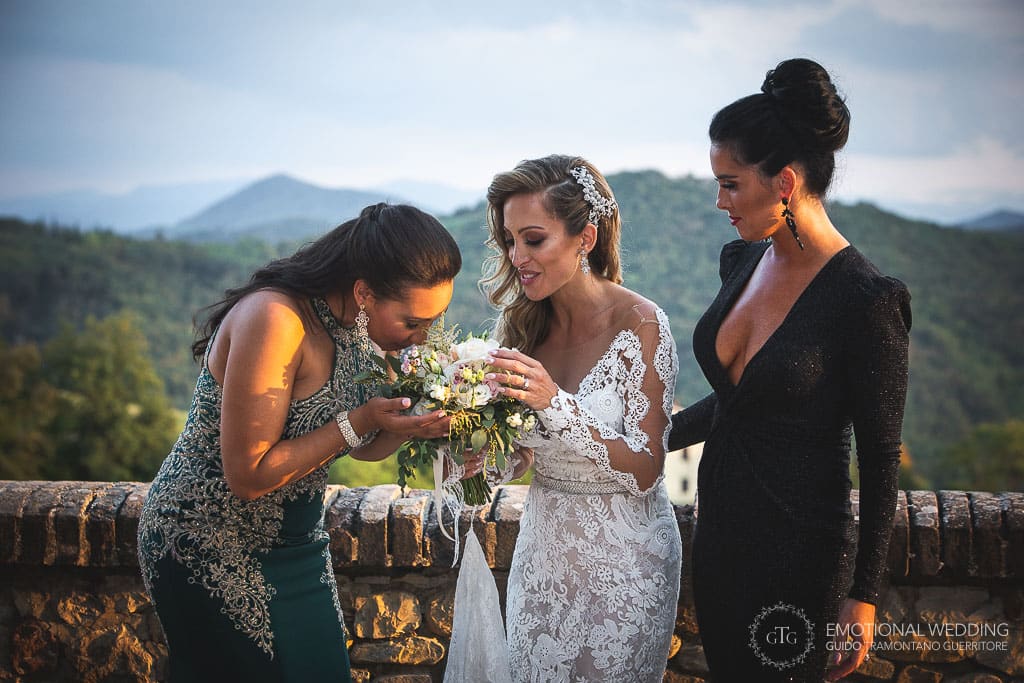 bridesmaid smells bridal bouquet at a destination wedding