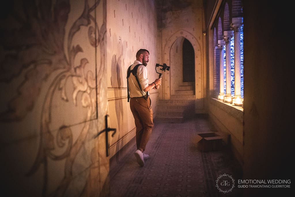 filmmaker at work at tabiano castle for a destination wedding in Fidenza