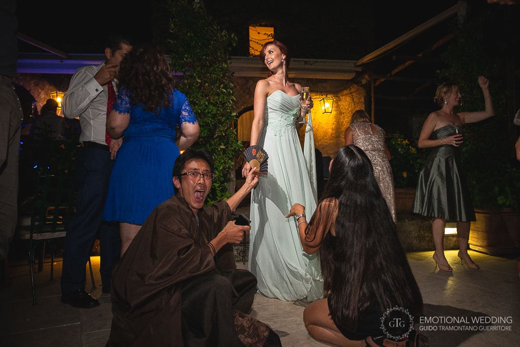 guests having fun at an Italian wedding at hotel Caruso in ravello
