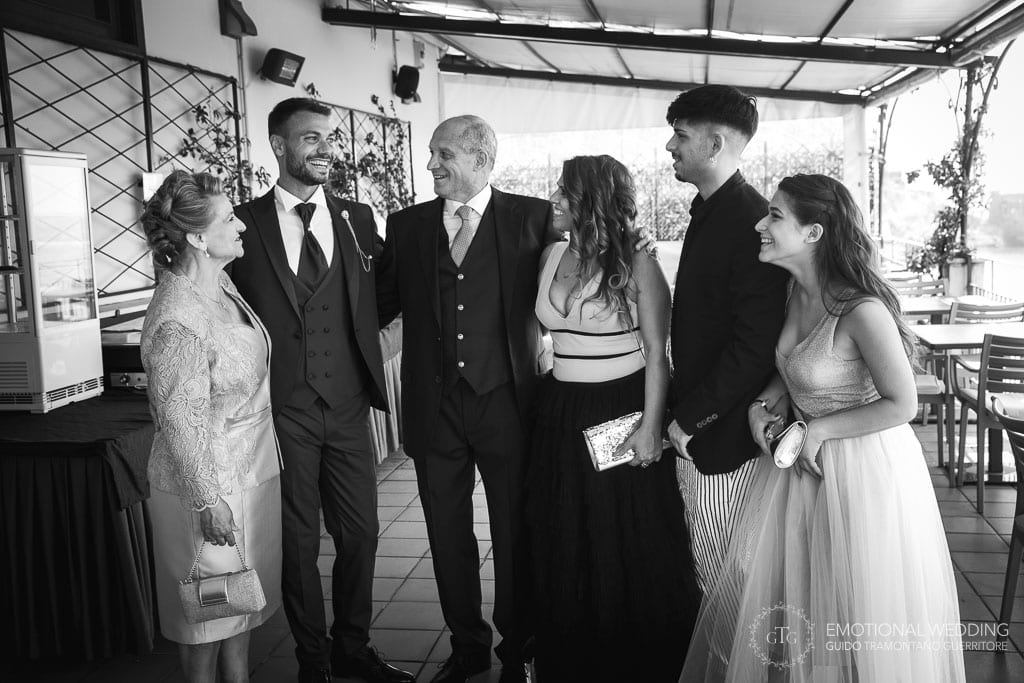 groom and his family smiling after getting ready for the wedding in maiori