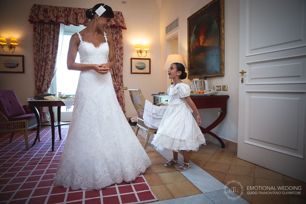 flower girl contemplating the bride at hotel Caruso in ravello