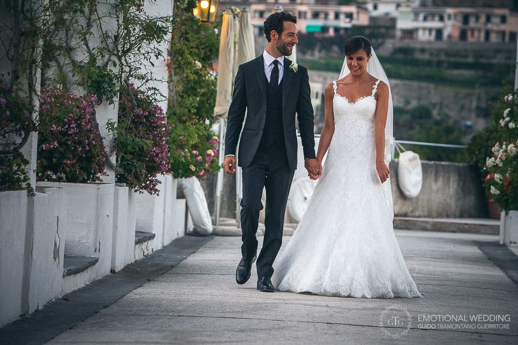 wedding couple walking through the gardens at hotel caruso in ravello