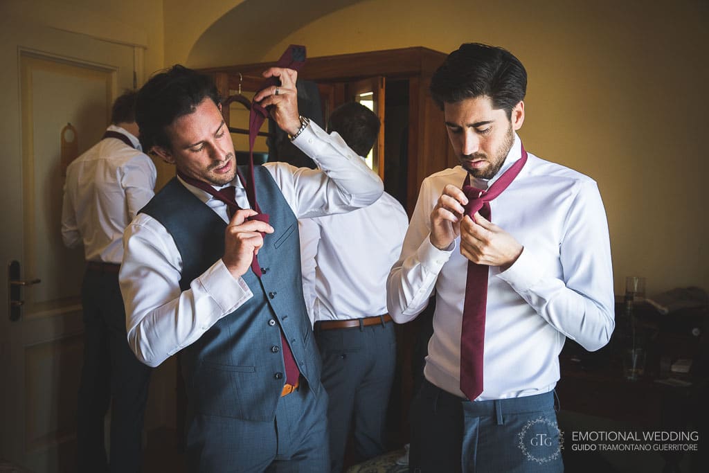 groom and best man wearing the tie at a wedding in sorrento