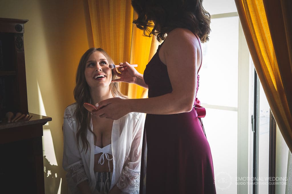 make up artist and bride getting ready at a wedding in sorrento