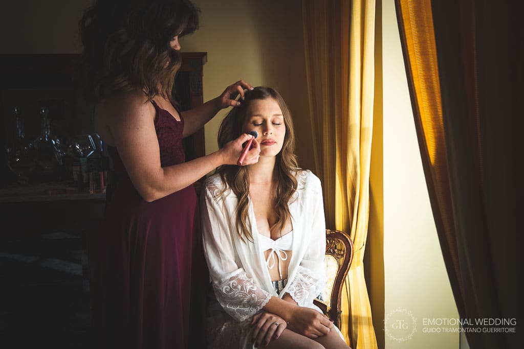 make up artist and bride getting ready at a wedding in sorrento
