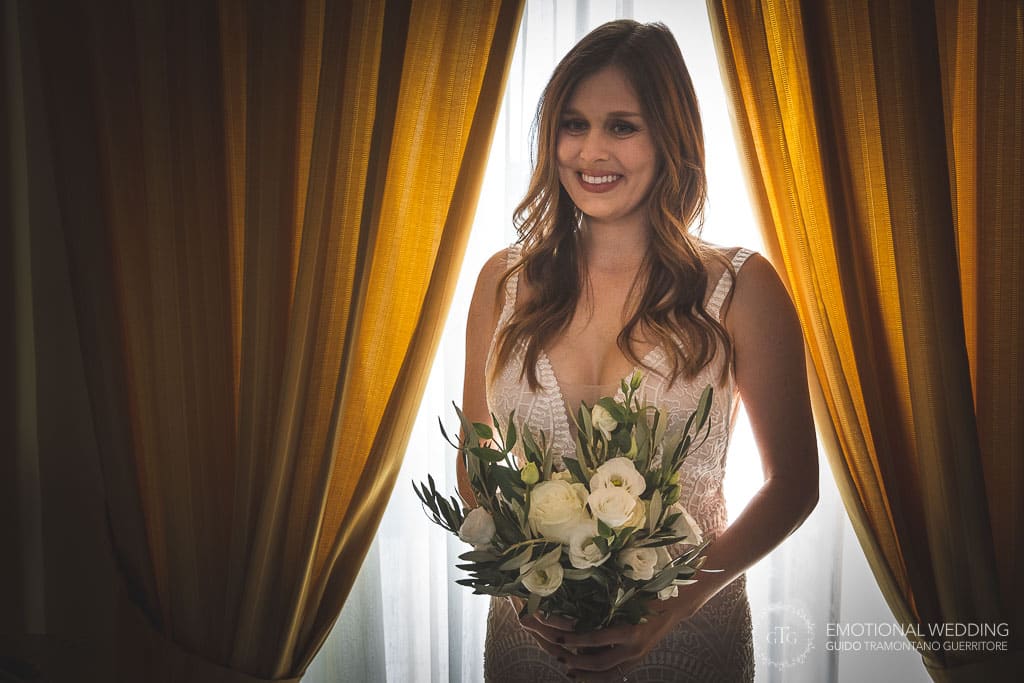 bride smiling in her hotel room at villa oasi olimpia in sorrento