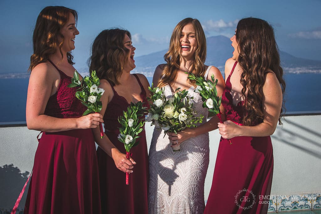 bride and bridesmaids laughing at a wedding in sorrento