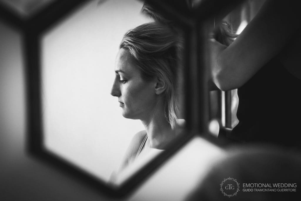 candid portrait of bride getting ready taken by a tuscany wedding photographer
