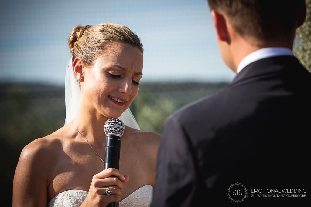 bride gets moved during wedding ceremony in tuscany