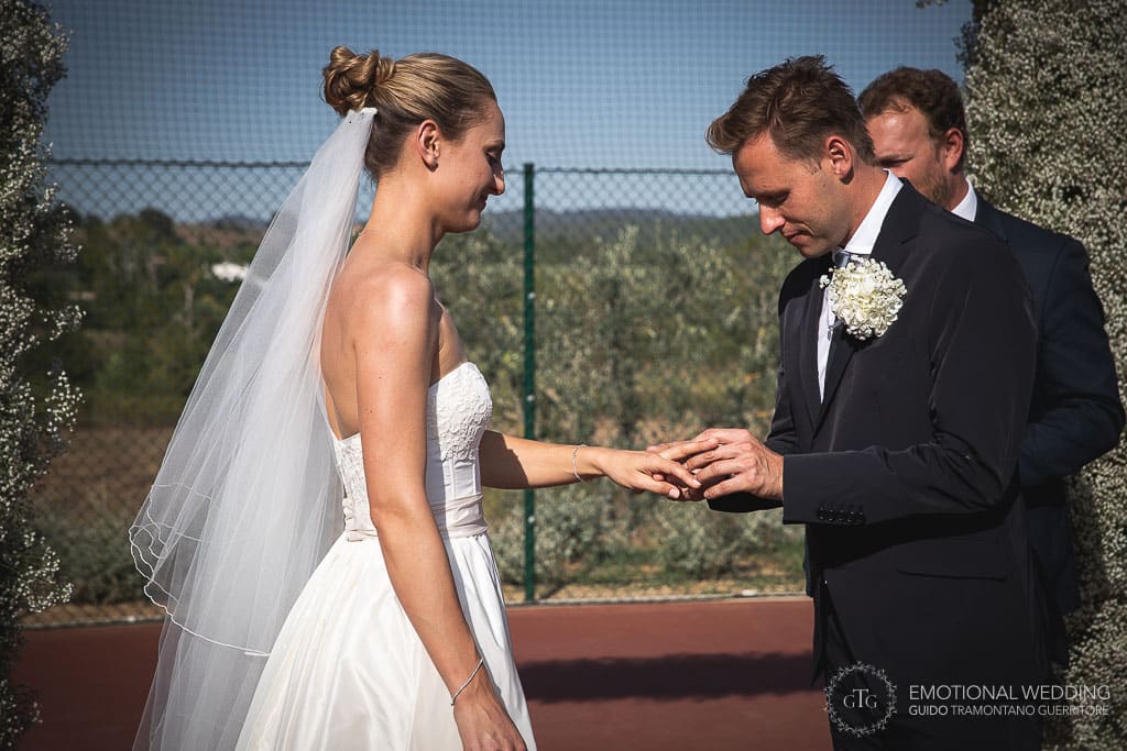 ring exchange at a wedding ceremony in tuscany