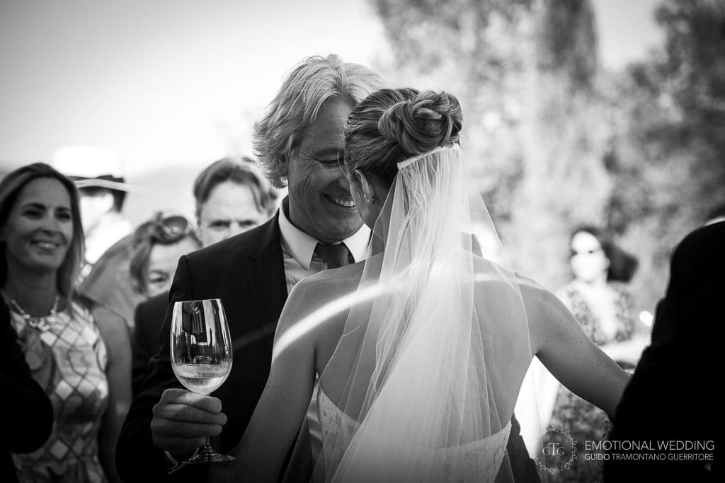 father of the bride smiles after wedding ceremony in tuscany