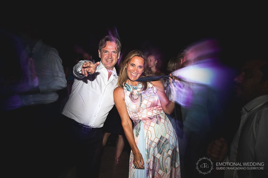 portrait of guests dancing at a wedding party in tuscany