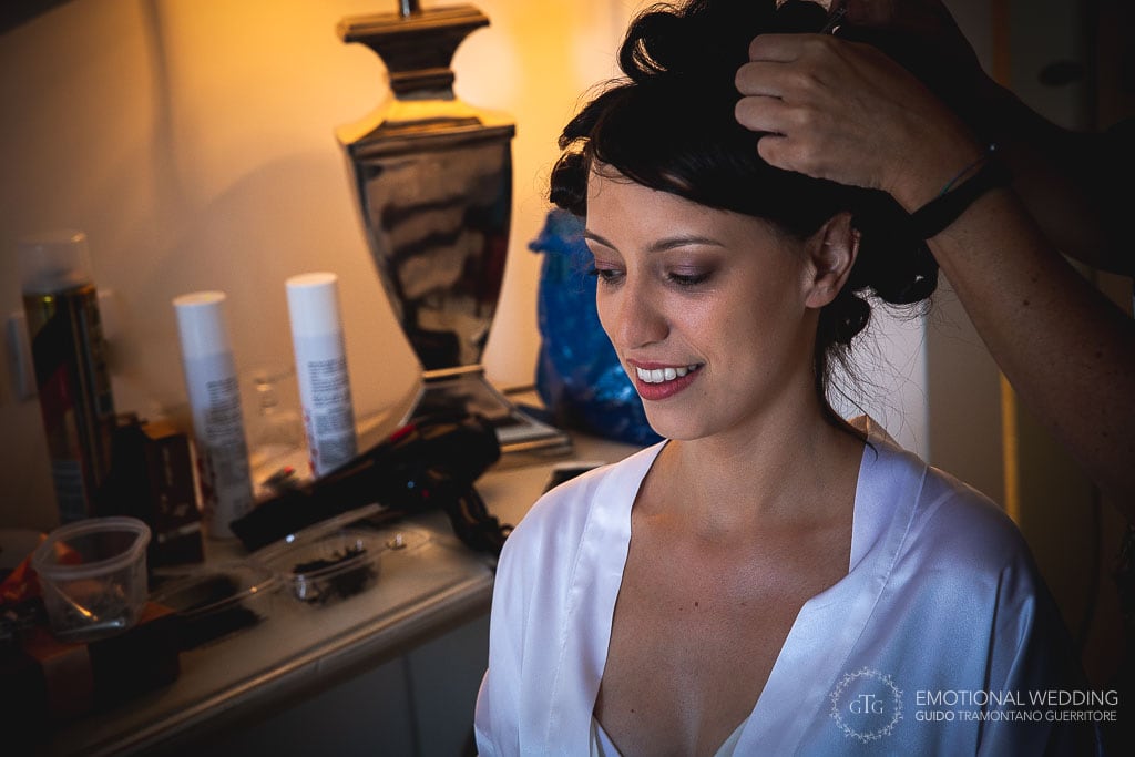 candid shot of a bride while getting ready for her wedding ceremony in praiano
