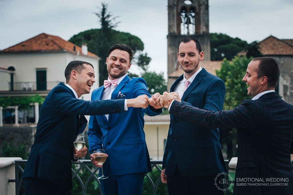 groom and friends smiling and cheering after getting ready for wedding ceremony in ravello