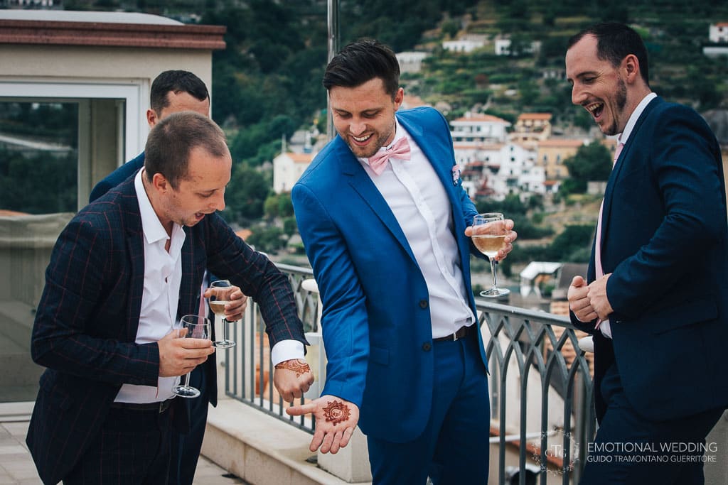 groom and best men laughing after getting ready in ravello